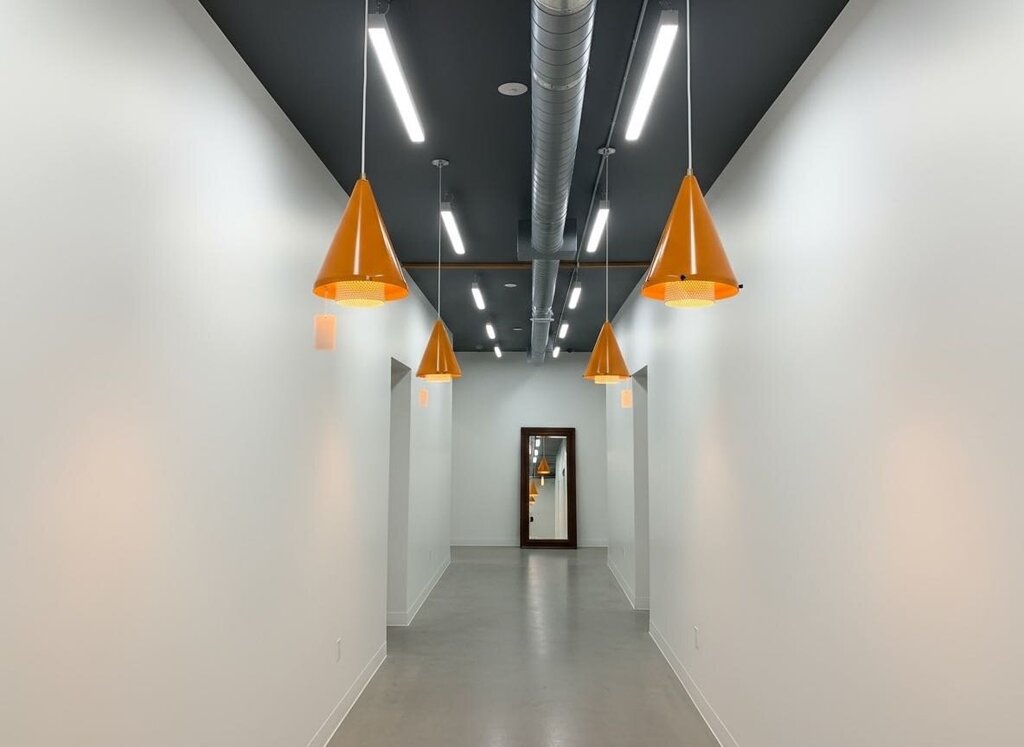 FABULOUS Pair of Gerald Thurston Pendant Lamp - Powder Coated in Orange with White Perforated Cylinder Floating in the Interior