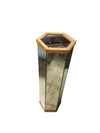 Mirrored Pedestal with wood trim accents and an octagonal shape